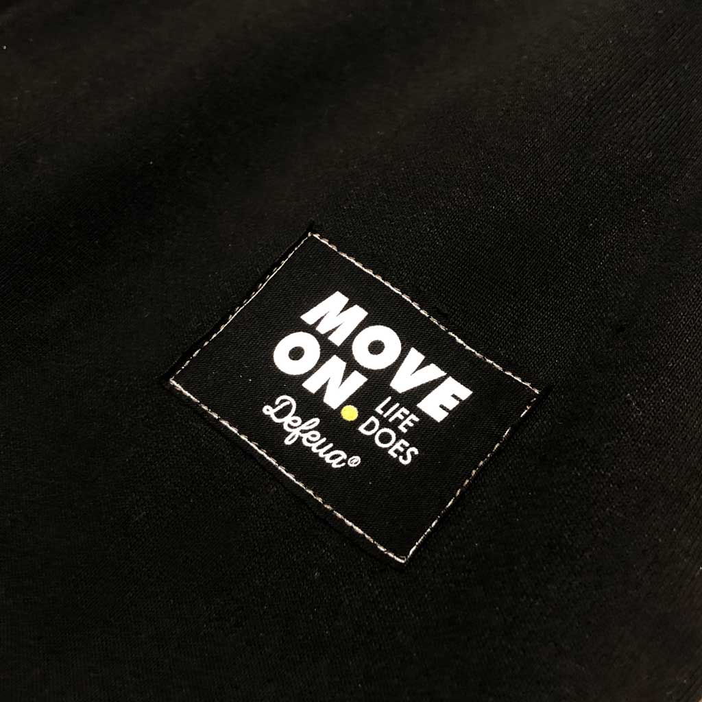 Defeua® MOVE ON, pantalone nero felpato in cotone biologico - dettaglio etichetta